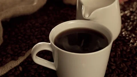 Coffee with milk in slow motion Stock Footage