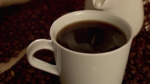 Coffee with milk in slow motion Video stock 76051896