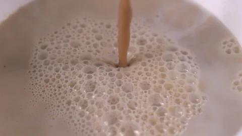 Coffee milk slow motion Stock Footage 123648383