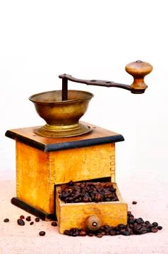 Coffee mill and beans Stock Photos