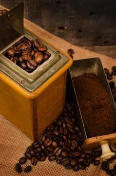 Coffee mill and beans Stock Photos