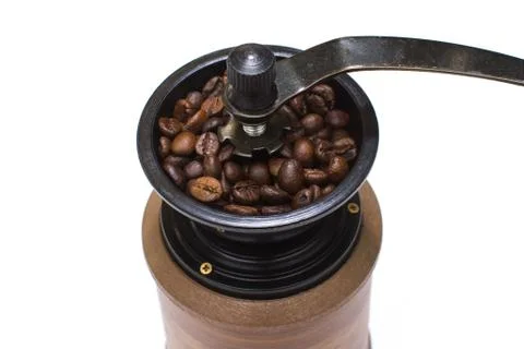 Coffee mill full coffee beans isolated on white background Stock Photos