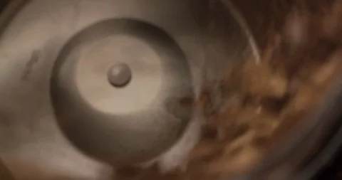 Coffee mill grinder grinds coffee beans extremely close up macro shot top view Stock Footage 98040695