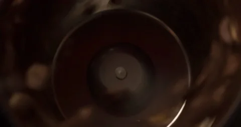Coffee mill grinder grinds coffee beans close up Slow Motion top view Stock Footage 98245746