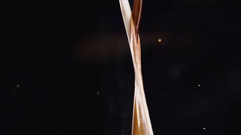 Coffee is mixed with milk Stock Footage 128546733