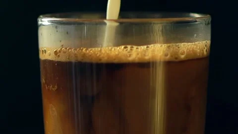 Coffee mixed with milk Stock Footage 236520315