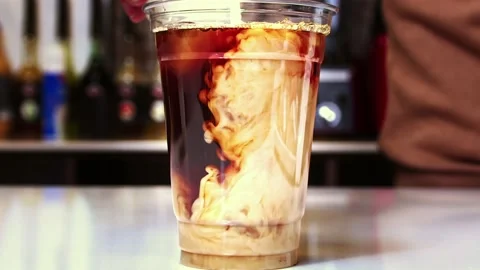 Coffee mixing with the milk Stock Footage 218601720