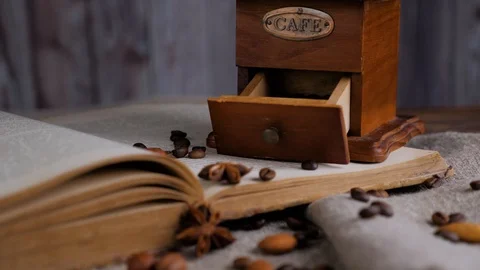 Coffee mood. Hygge concept with open book and coffee beans. Stock Footage 129362845