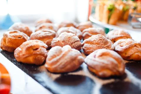 Coffee muffins on the buffet table at the event. Fresh cakes. Stock Photos