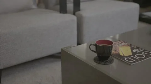 Coffee Mug and Magazine on Table in Modern Lounge Stock Footage 344603817
