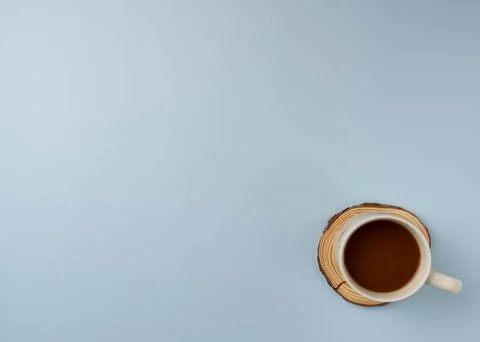 Coffee mug on blue background Stock Photos