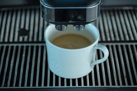 Coffee mug on a coffee machine. Stock Photos