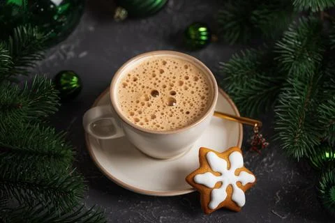 Coffee mug with gingerbread snowflake cookie and christmas decorations Stock Photos
