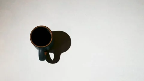 Coffee Mug with Moving Shadows Stock Footage 135162421