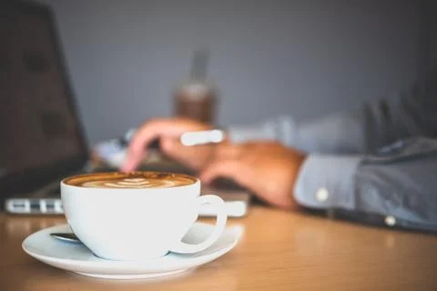 Coffee mug placed on the desk Stock Photos