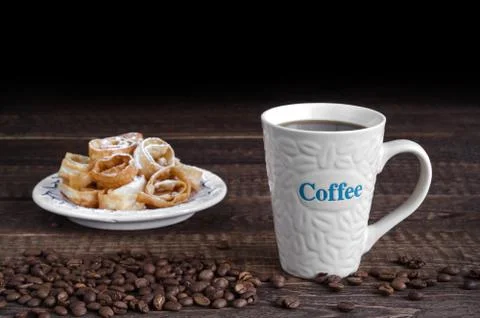 Coffee mug, refried beans and cookies in powdered sugar in the background. Low 写真素材