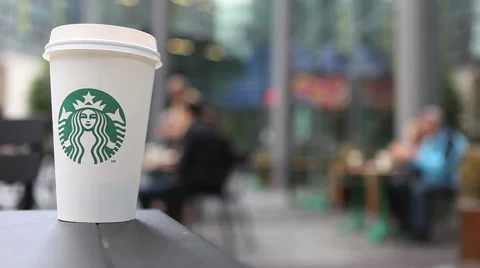 Coffee mug in Starbucks cafe Stock Footage