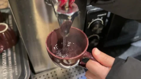 Coffee mug steaming, Steaming coffee being poured into ceramic mug on countertop Stock Footage 325126217