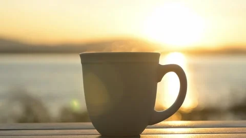 Coffee mug with a sunrise view Stock Footage 293142875