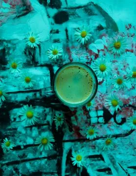 Coffee mug on the table with daisies 写真素材