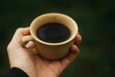 Coffee mug on the table Stock Photos