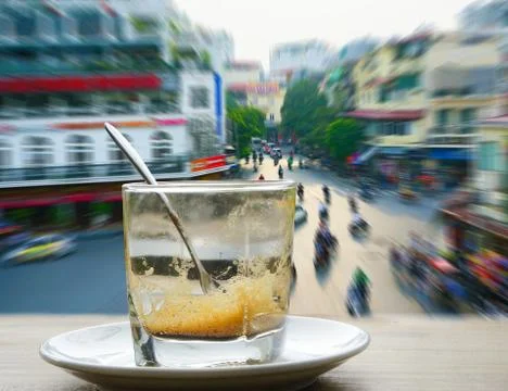 Coffee mugs on the table in front of window with Colorful zoom with street,tr Stock Photos