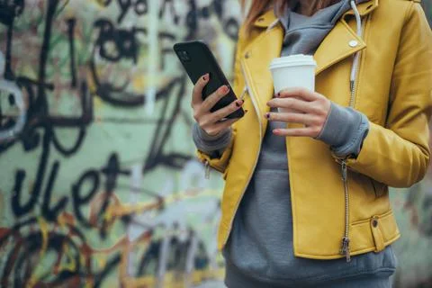 Coffee in one hand, contacts in the other Stock Photos