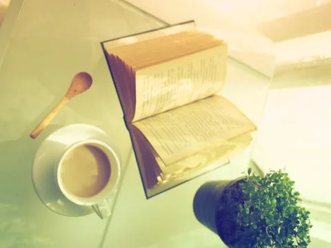 Coffee open book and small tree Stock Photos