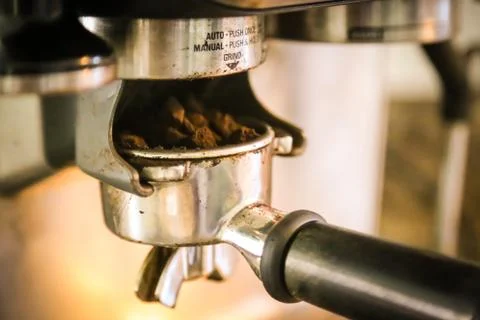 Coffee, or espresso making process - grinding and extracting coffee beans Stock Photos