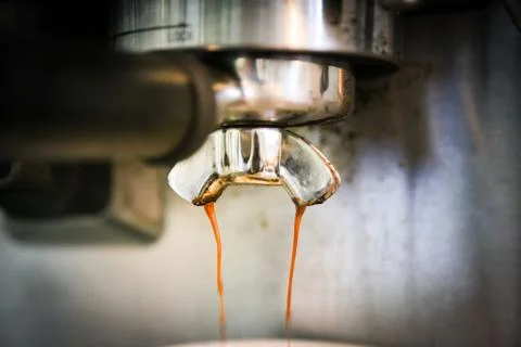 Coffee, or espresso making process - grinding and extracting coffee beans Stock Photos