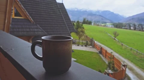 Coffee or Tea. Brown Rustic Cup of hot beverage with Steam Outdoors. 4K. Видео 66755445