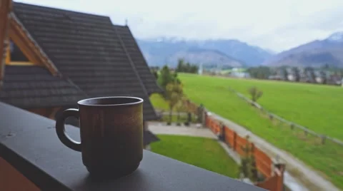 Coffee or Tea. Brown Rustic Cup of hot beverage with Steam Outdoors. 4K. Stock Footage 66755569