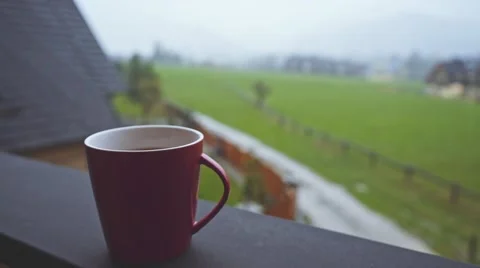 Coffee or Tea. Red Classic Cup of hot beverage Steaming Outdoors. 4K. Vidéo 66756957