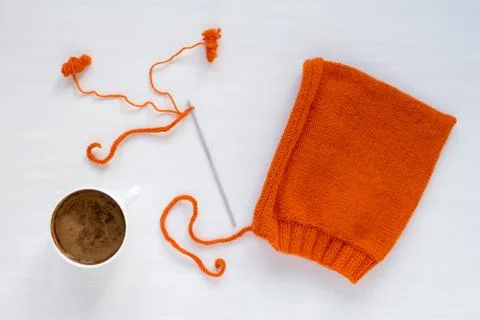 Coffee, orange and handmade hat on white background Stock Photos