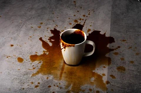 Coffee Overflow Splash Spilling from Cup Stock-Fotos