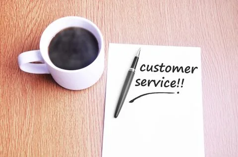 Coffee, pen and notes write customer service Foto stock