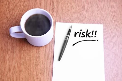 Coffee, pen and notes write risk Stock Photos