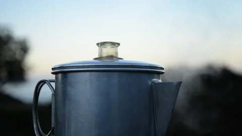 Coffee percolating at the mountain campsite, with rack focus Stock Footage 88786754