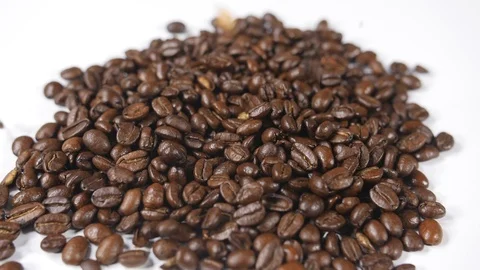 Coffee in a pile with individual beans poured onto a heap for hot drinks Stock Footage 88514494