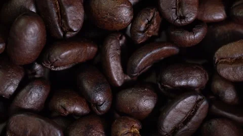 Coffee pondCoffee beans close-up top view circular rotation. Stock Footage 144548823