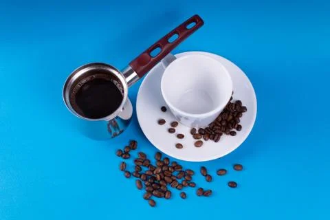 Coffee pot next to an empty cup Stock Photos