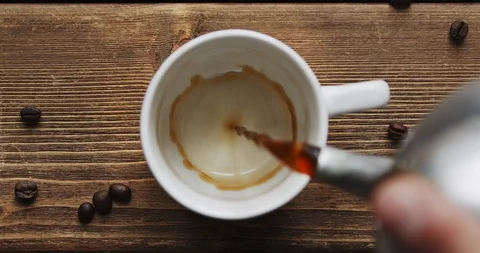 Coffee pour into cup from big coffee maker Stock Footage 125572215