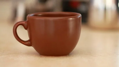 Coffee poured into a brown cup. Stock Footage 70400340