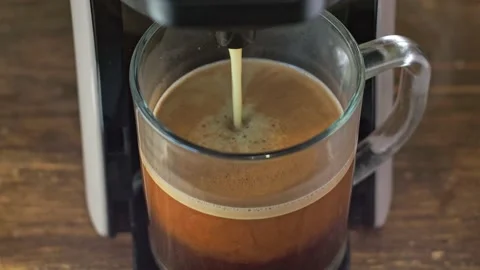 Coffee is poured from the coffee machine. close-up from above. home-made hot Video stock 165833196