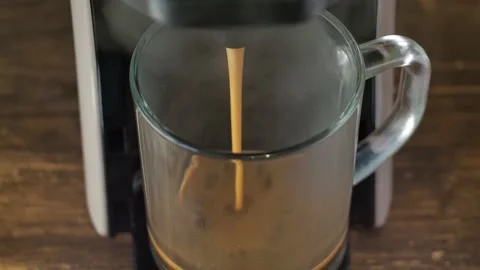 Coffee is poured from the coffee machine. close-up from above. home-made hot Stock Footage 167227758
