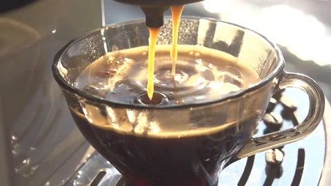 Coffee is poured from a coffee machine into a coffee cup Video stock 120193741