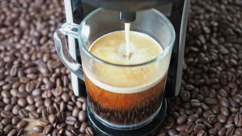 Coffee is poured from the coffee machine. seeds are lying around. homemade Stock Footage 166464112