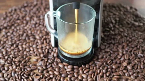 Coffee is poured from the coffee machine. seeds are lying around. homemade Stock Footage 167559308
