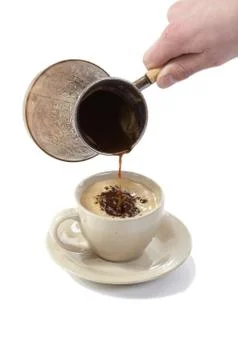 Coffee poured from coffee maker in cup Stock Photos