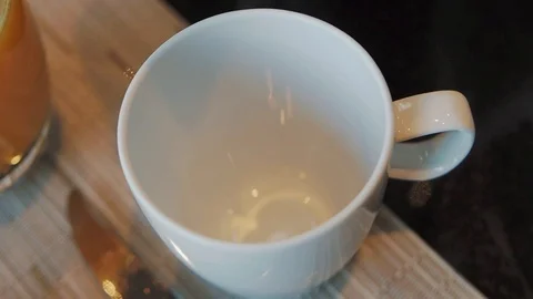 Coffee poured from coffee pot into a cup Stock Footage 124113933